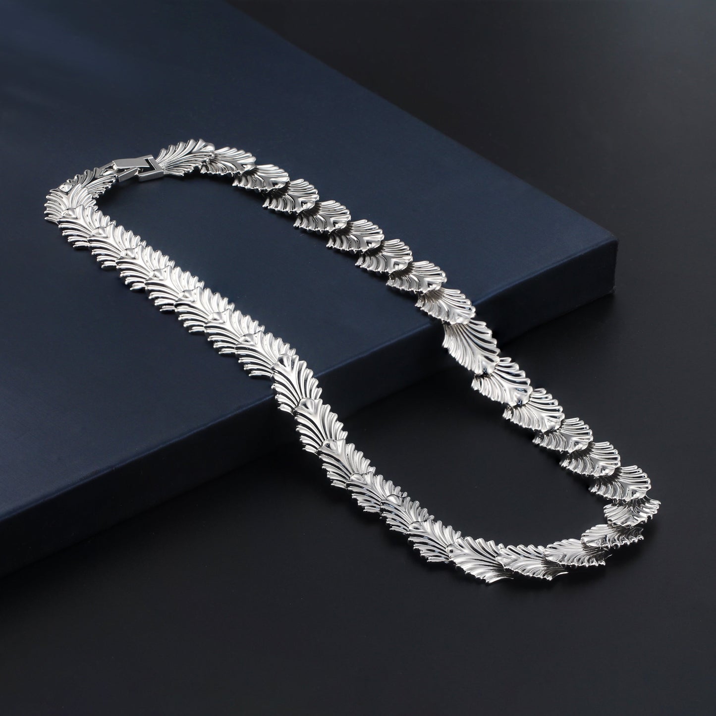 Elegant palm link necklace featuring interconnected palm-shaped links, crafted from high-quality sterling silver, designed for versatile layering and everyday elegance.