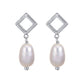 Golden Axis Pearl Drop Earrings featuring 11mm freshwater pearls and textured square silver drops with rhodium plating.